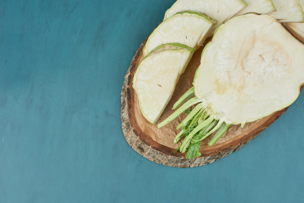 Sliced celery corn on a wooden board. High quality photo